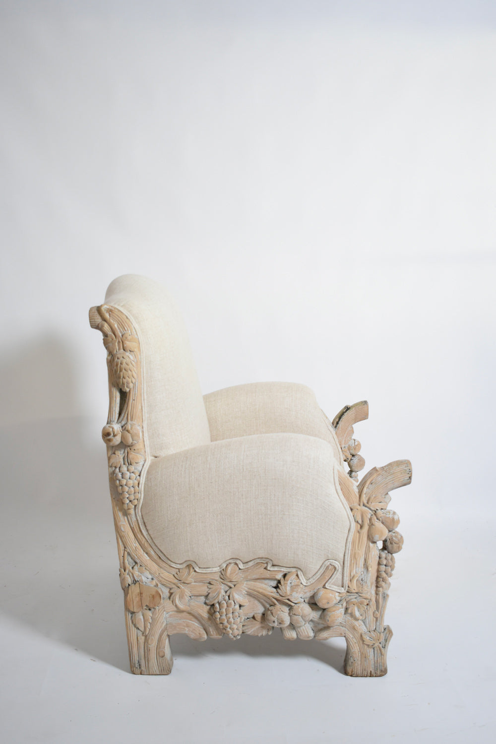 Carved limed oak fruits and foliage armchair, 1970s.