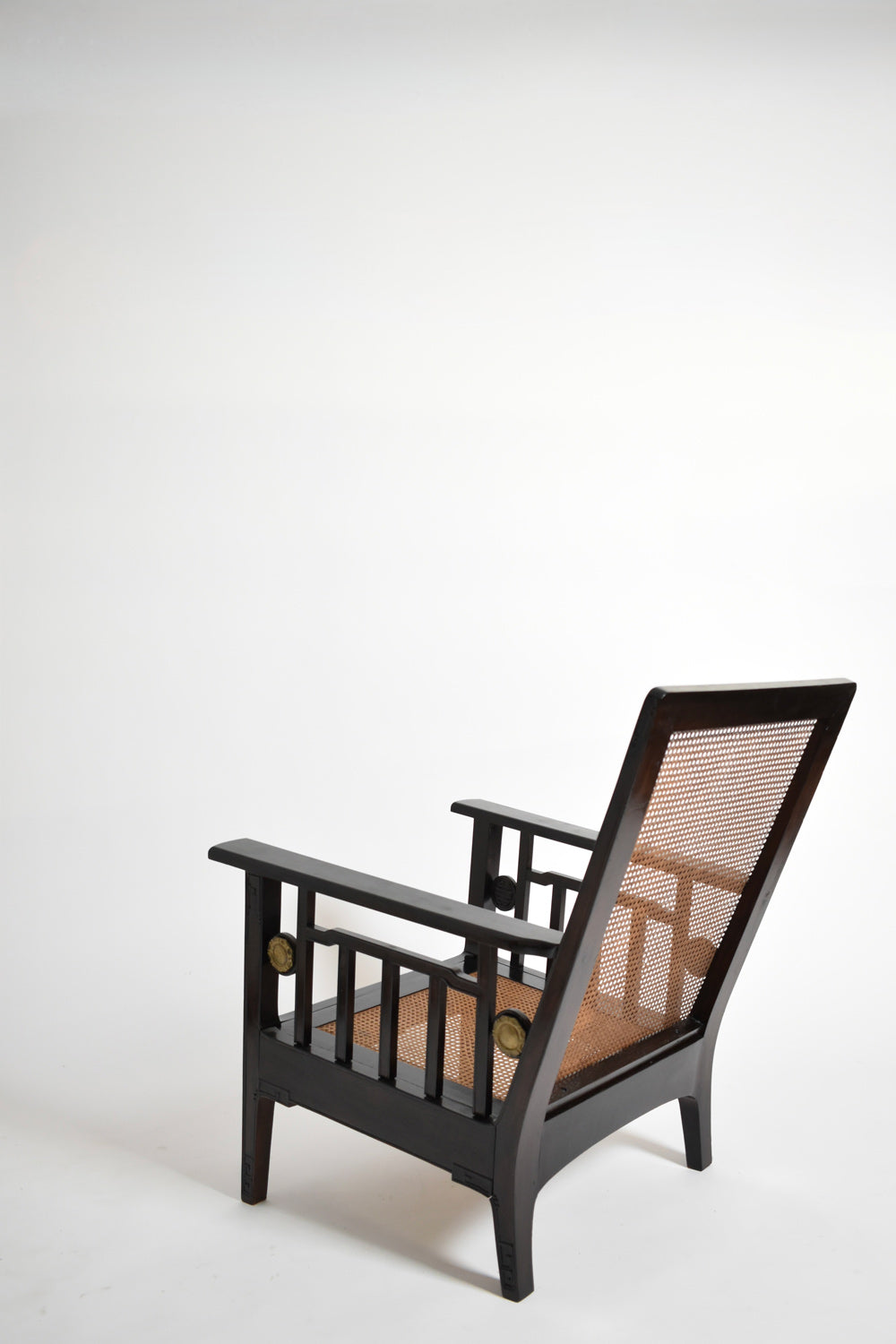 Pair of colonial ebonised wood & caning armchairs, 1920s.