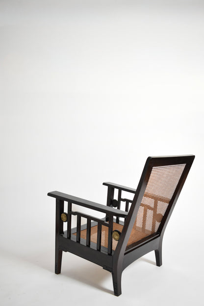 Pair of colonial ebonised wood & caning armchairs, 1920s.