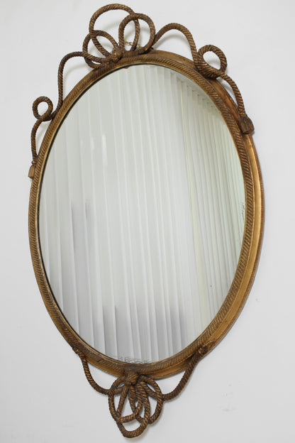 Important oval trimmings and pompoms mirror, XIXth c.