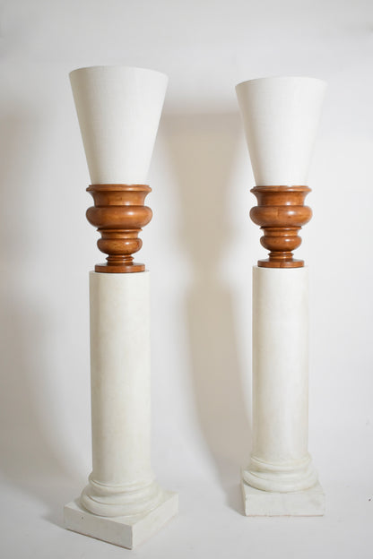 Pair of plaster columns and wooden lamps vases.