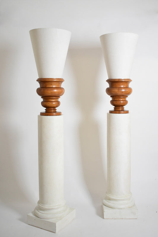 Pair of plaster columns and wooden lamps vases.