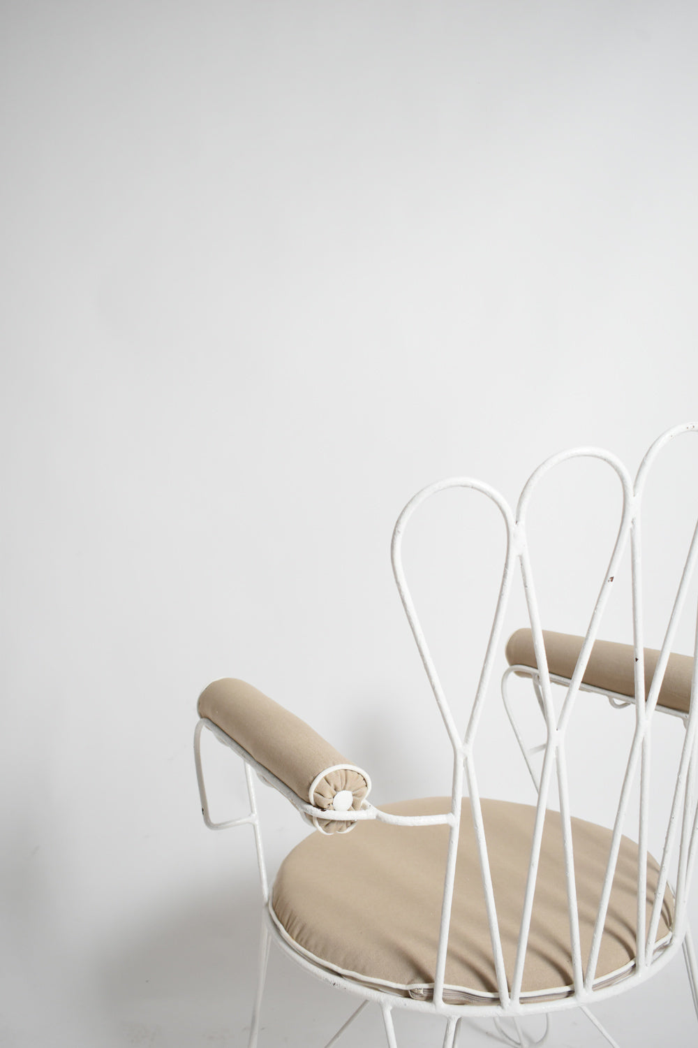 Pair of garden white wrought iron chairs, 1960s.