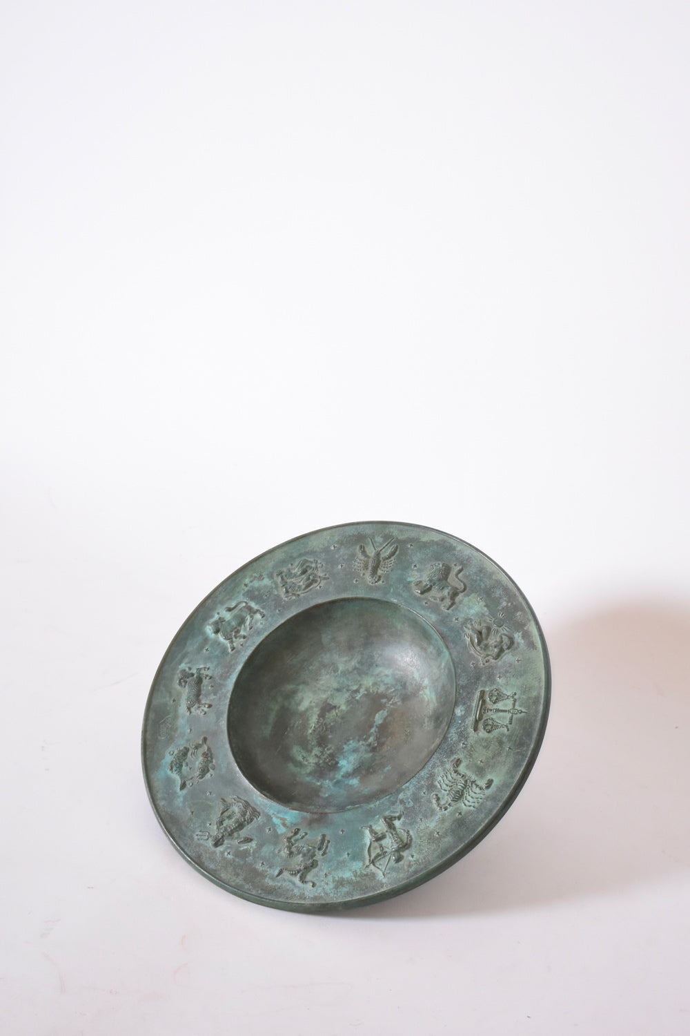 Circular neoclassical bronze plate, 1940s.