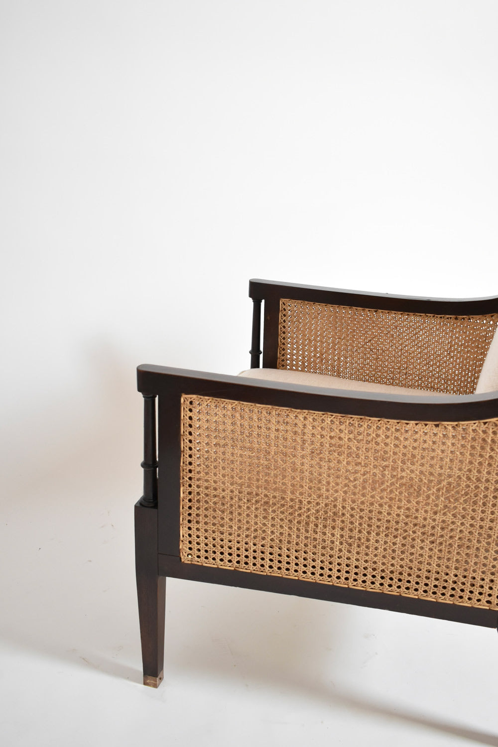 Pair of neoclassical wooden and caning armchairs, 1960s.