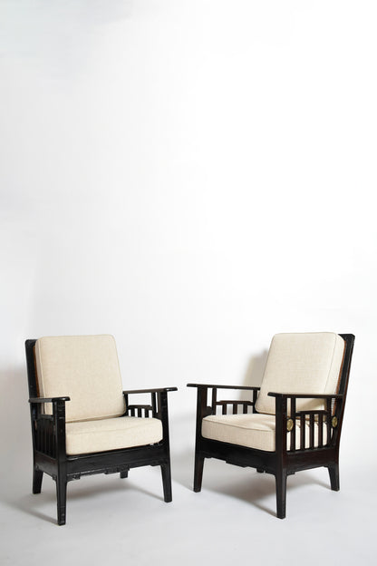 Pair of colonial ebonised wood & caning armchairs, 1920s.