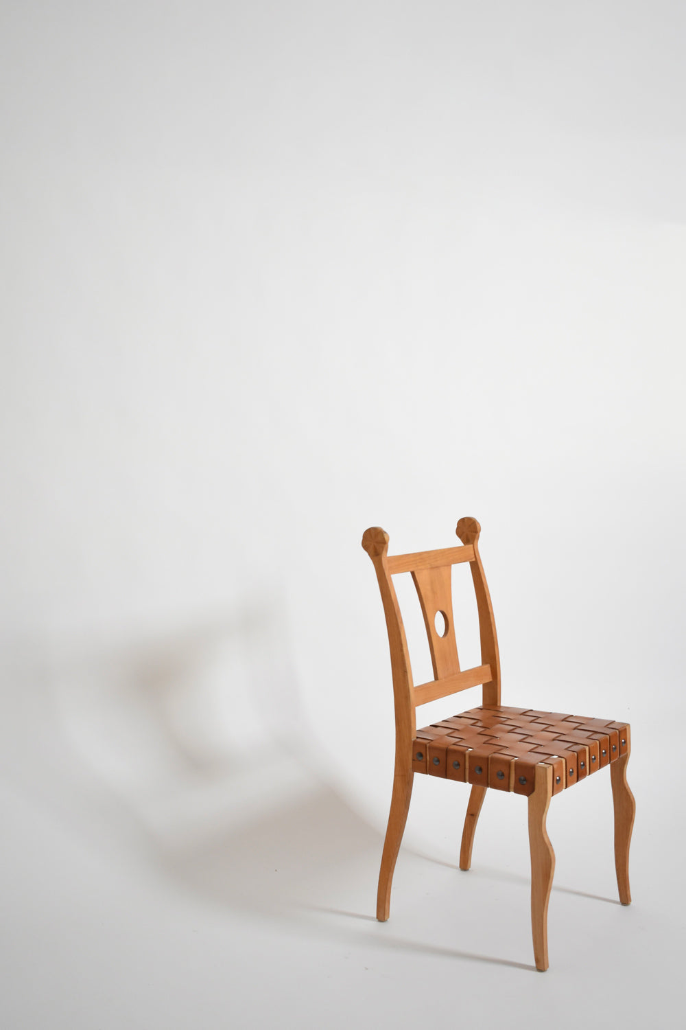 Pair of etruscan oak and leather chairs, 1970s.