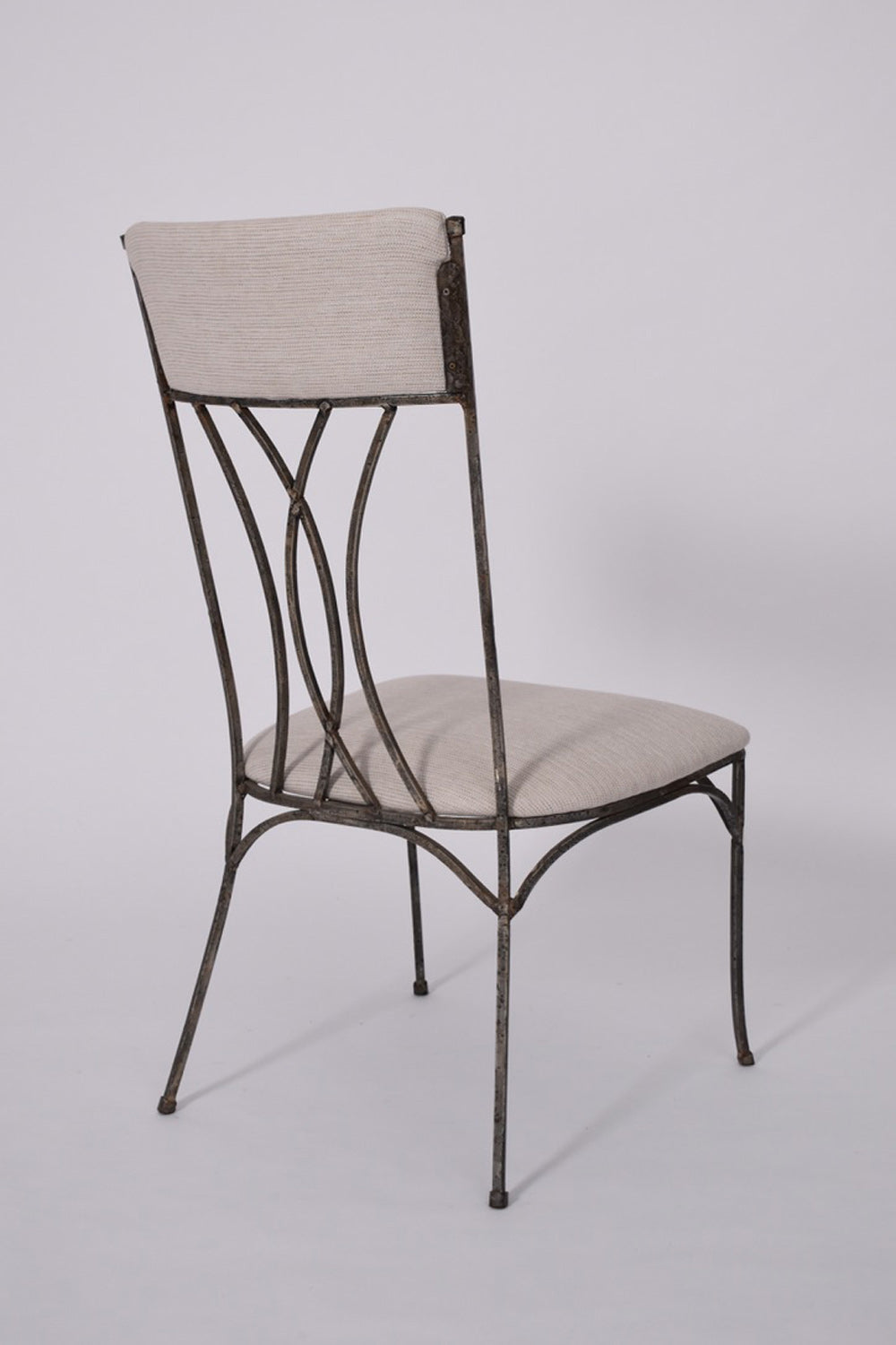 Pair of neoclassical iron chairs, 1960s.