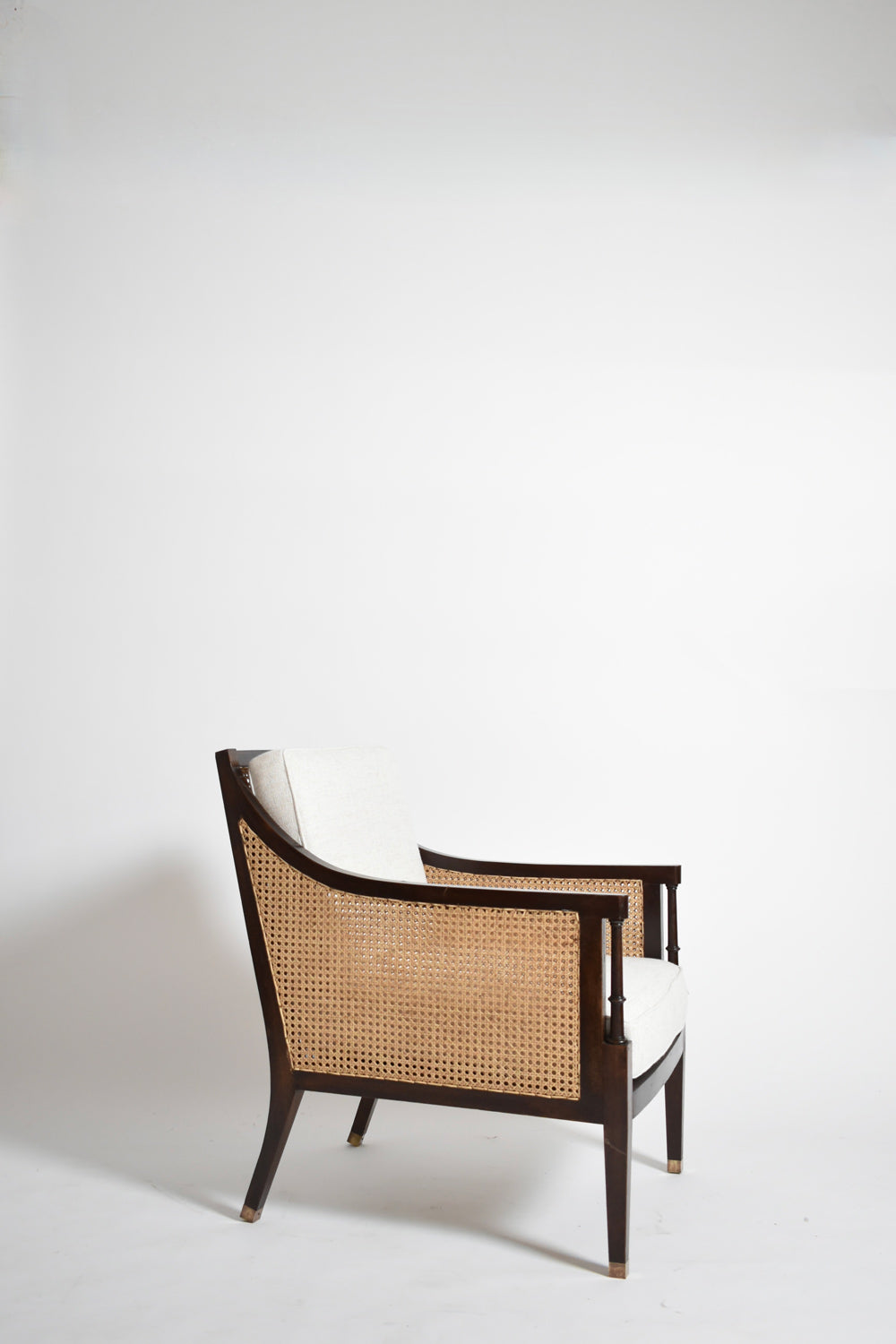 Pair of neoclassical wooden and caning armchairs, 1960s.
