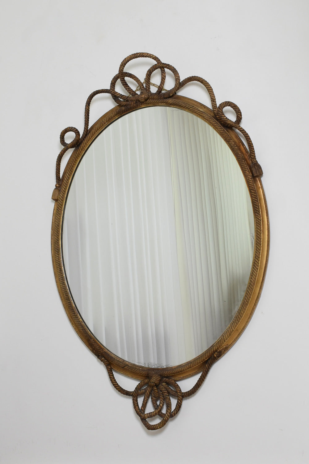 Important oval trimmings and pompoms mirror, XIXth c.