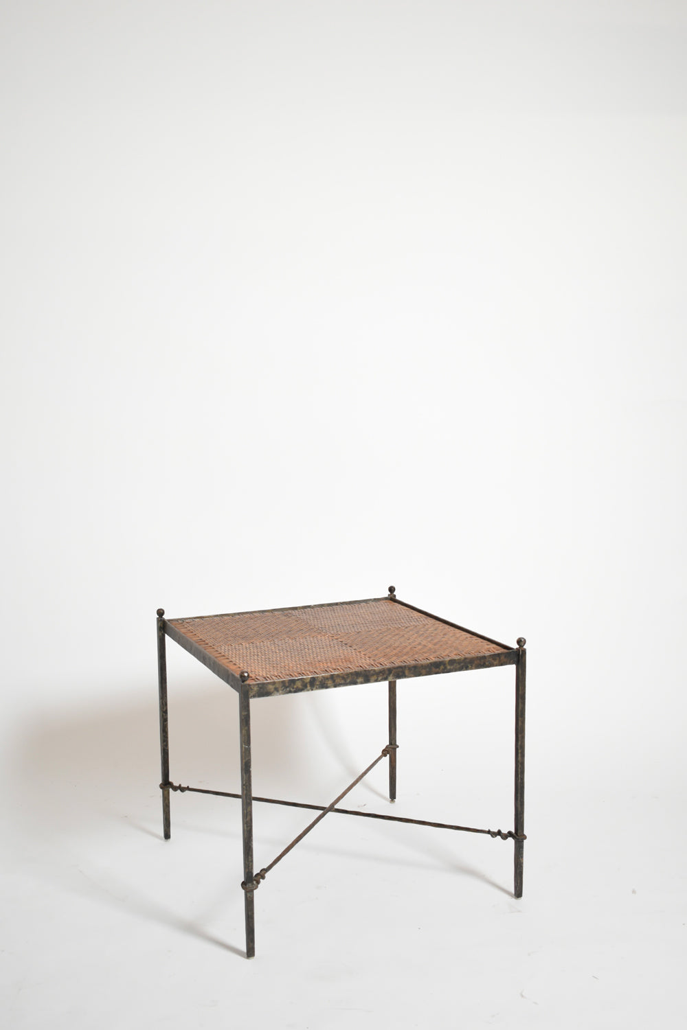 Pair of wrought iron and wicker side tables, 1970s.