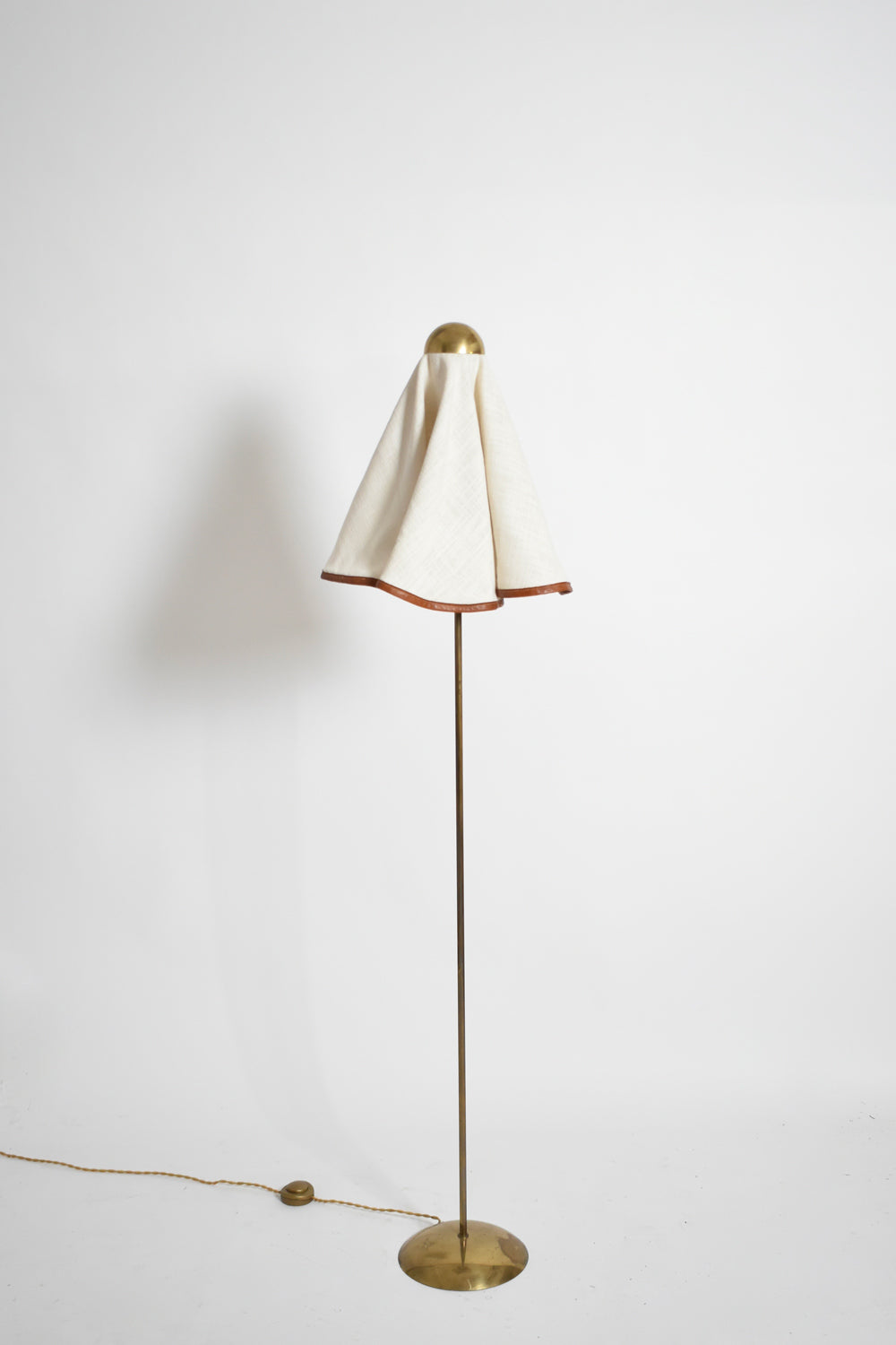 Brass, fabric and leather floor lamp, 1960s.