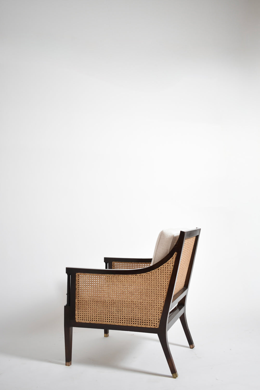 Pair of neoclassical wooden and caning armchairs, 1960s.