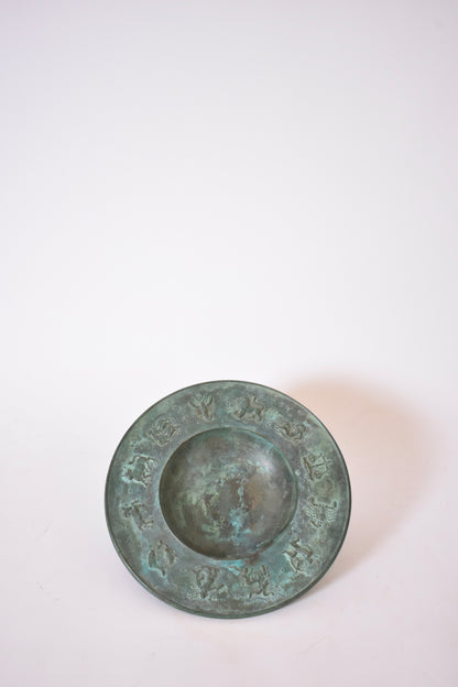 Circular neoclassical bronze plate, 1940s.