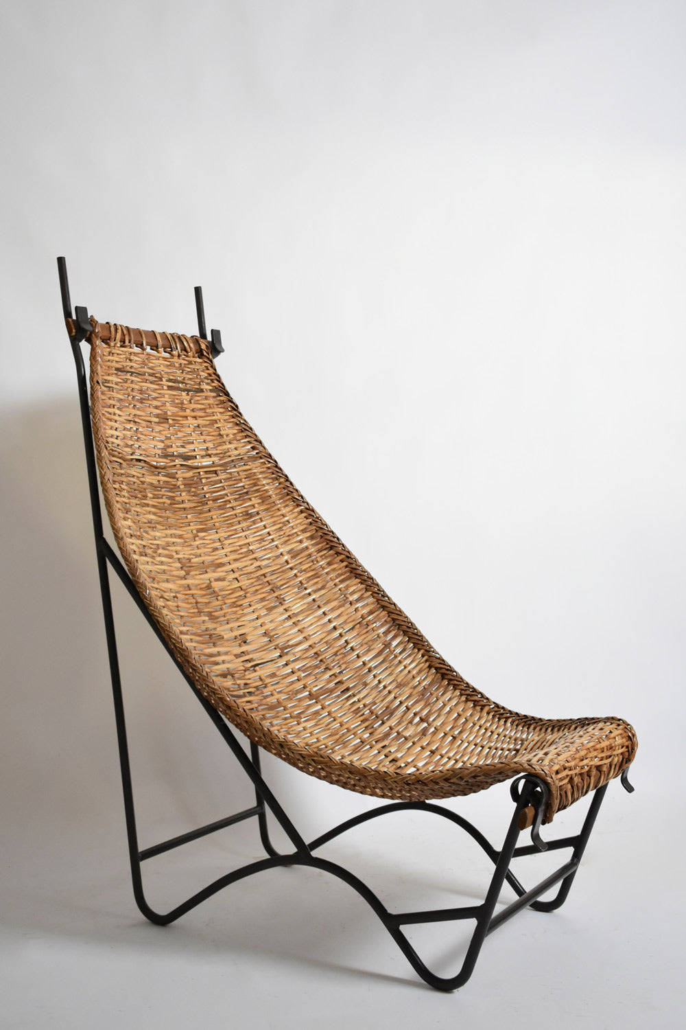 Wrought iron and rattan armchair, 1950s.