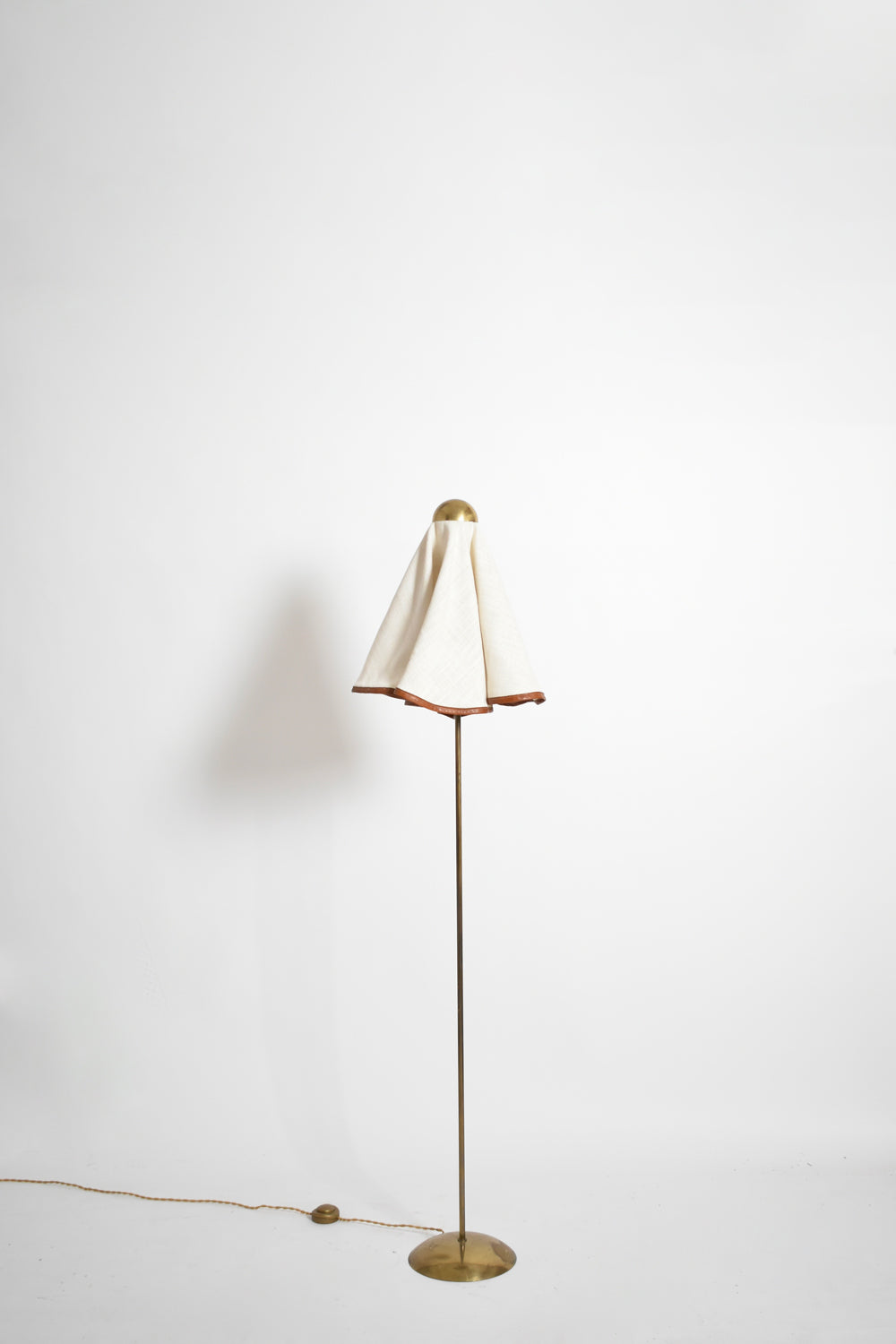 Brass, fabric and leather floor lamp, 1960s.
