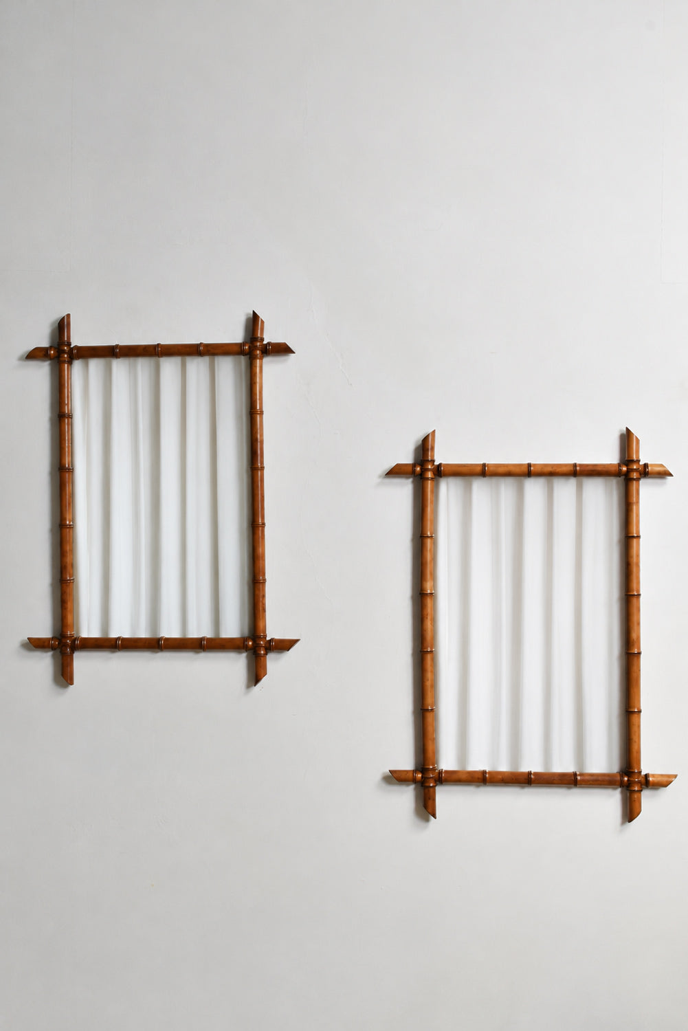 Pair of wooden faux bamboo mirrors, 1920s.