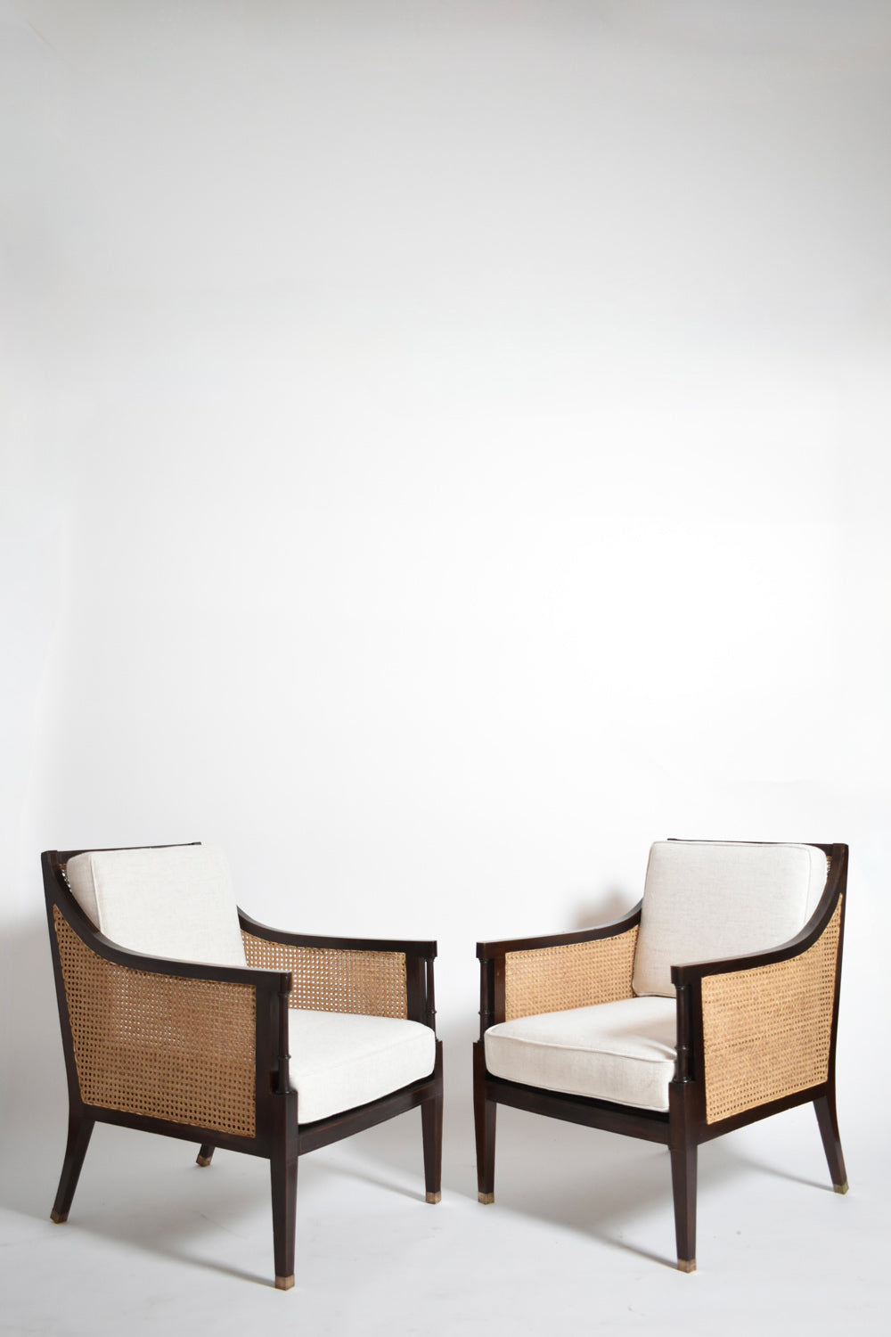 Pair of neoclassical wooden and caning armchairs, 1960s.