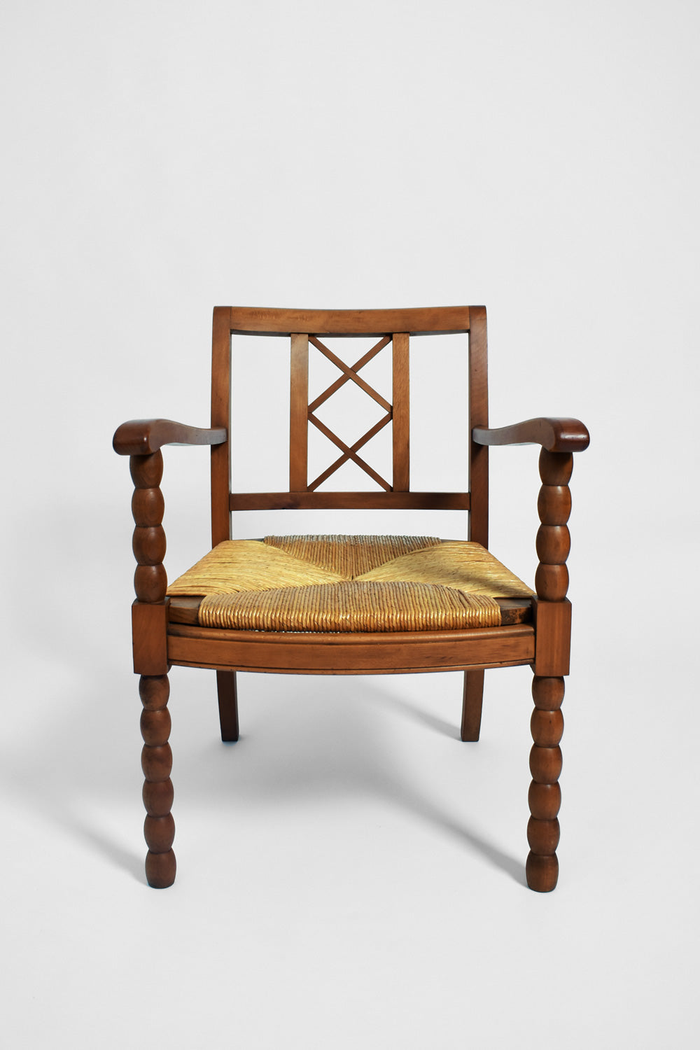 Pair of straw and wood armchairs, 1950s.