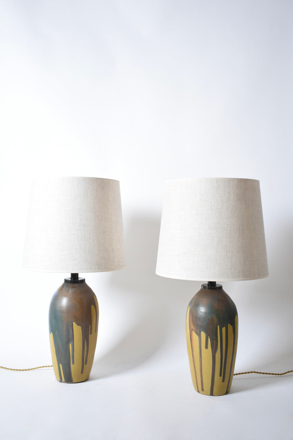 Pair of ochre and brown glaze drips lamps, 1930s.